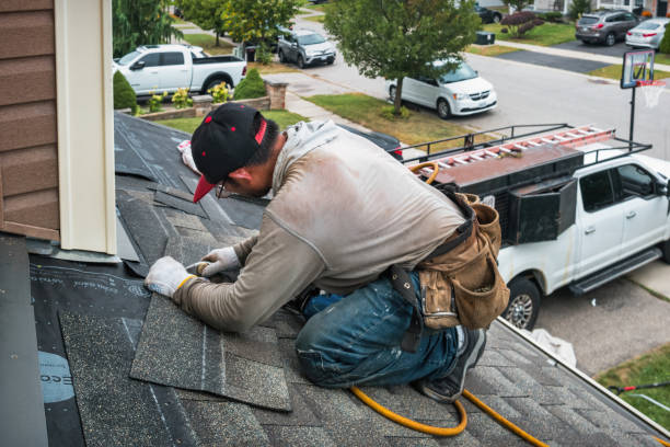 Professional Roof Replacement technician working in Albertson, NY